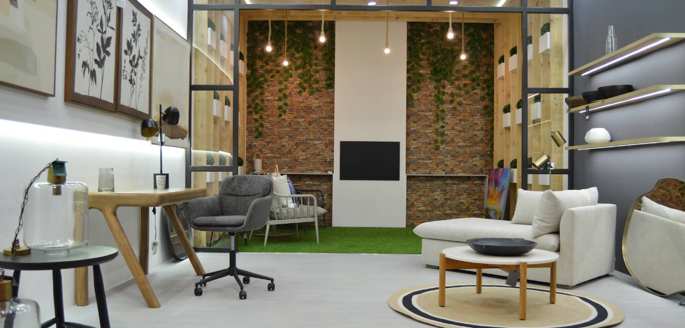 The My Creation display space with a desk, armchair, sofa and shelving styled as a room