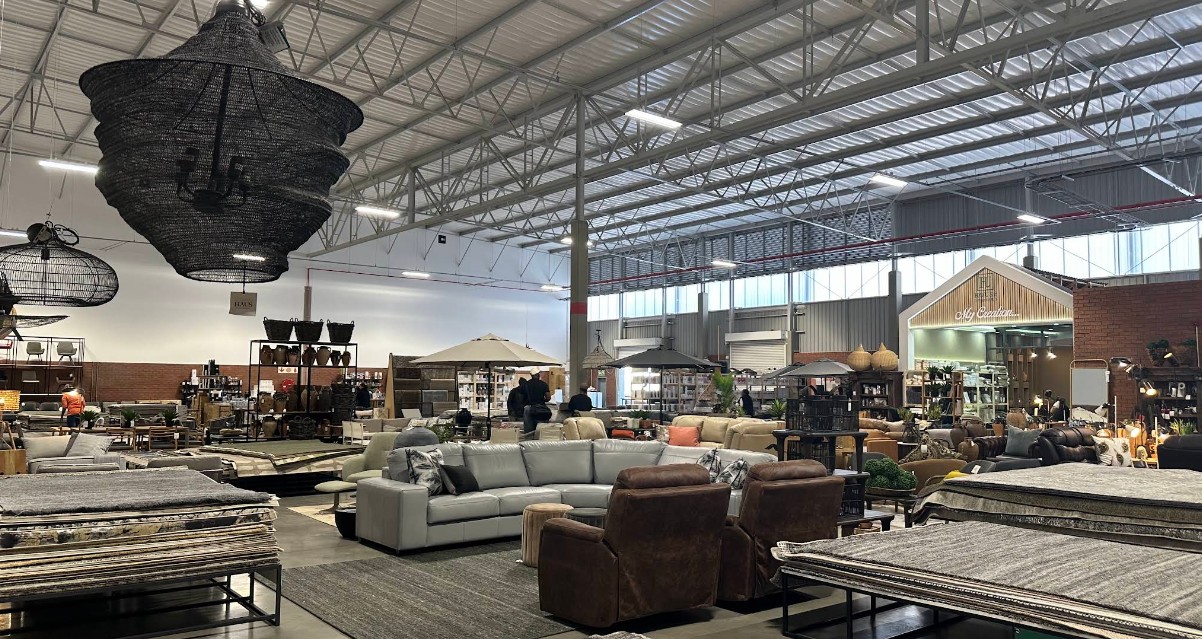 The House Unboxed warehouse showroom floor, filled with sofas, rugs, umbrellas and lighting